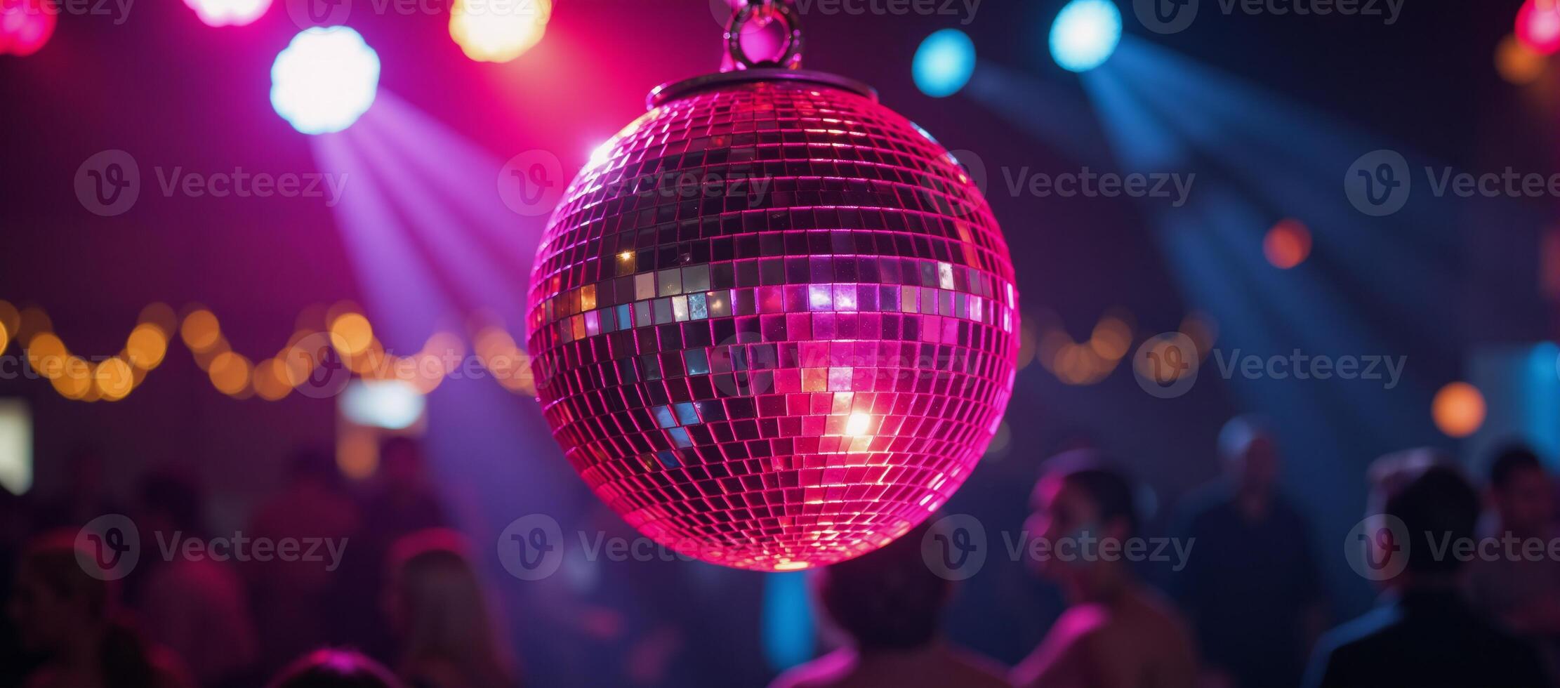 A closeup image featuring a lively disco scene against a backdrop of vibrant neon lights and a sparkling pink disco ball photo