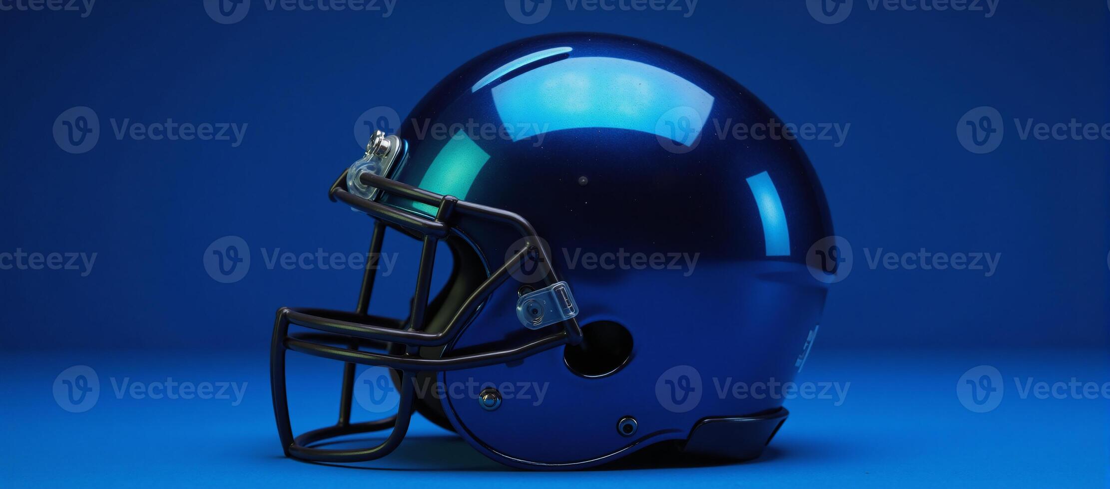 Football helmet on a blue backdrop with shimmery slightlytinted blue design as its central feature photo