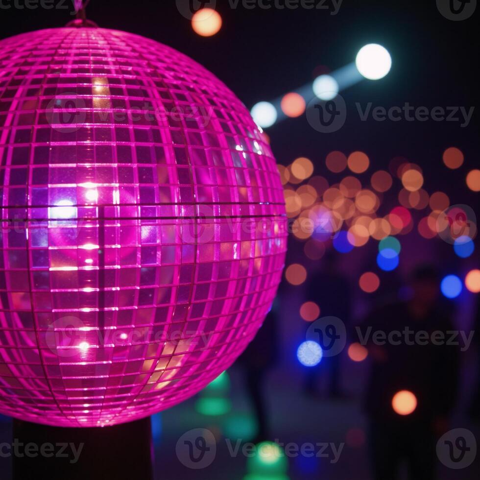A closeup image featuring a lively disco scene against a backdrop of vibrant neon lights and a sparkling pink disco ball photo