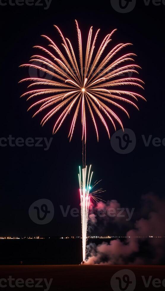 A striking shot showcasing a brightly glowing starburst from exploding fireworks against a dark backdrop at night photo