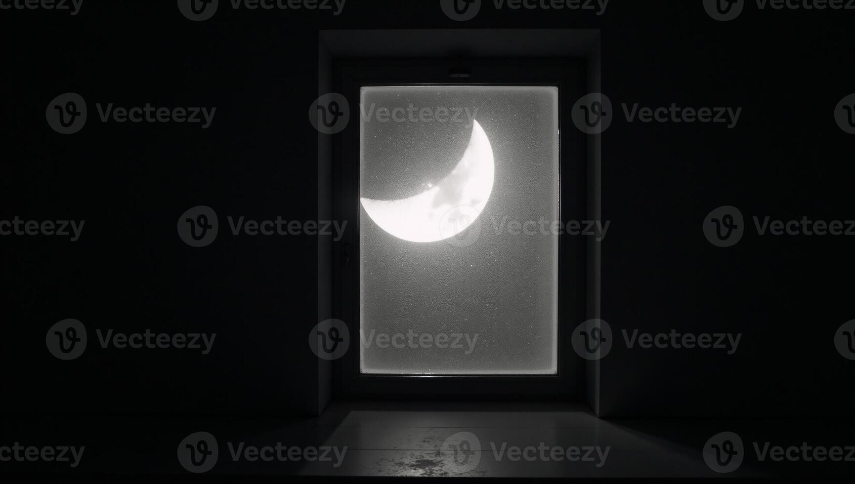 A halfmoon illuminates a dark room from an open window at night photo