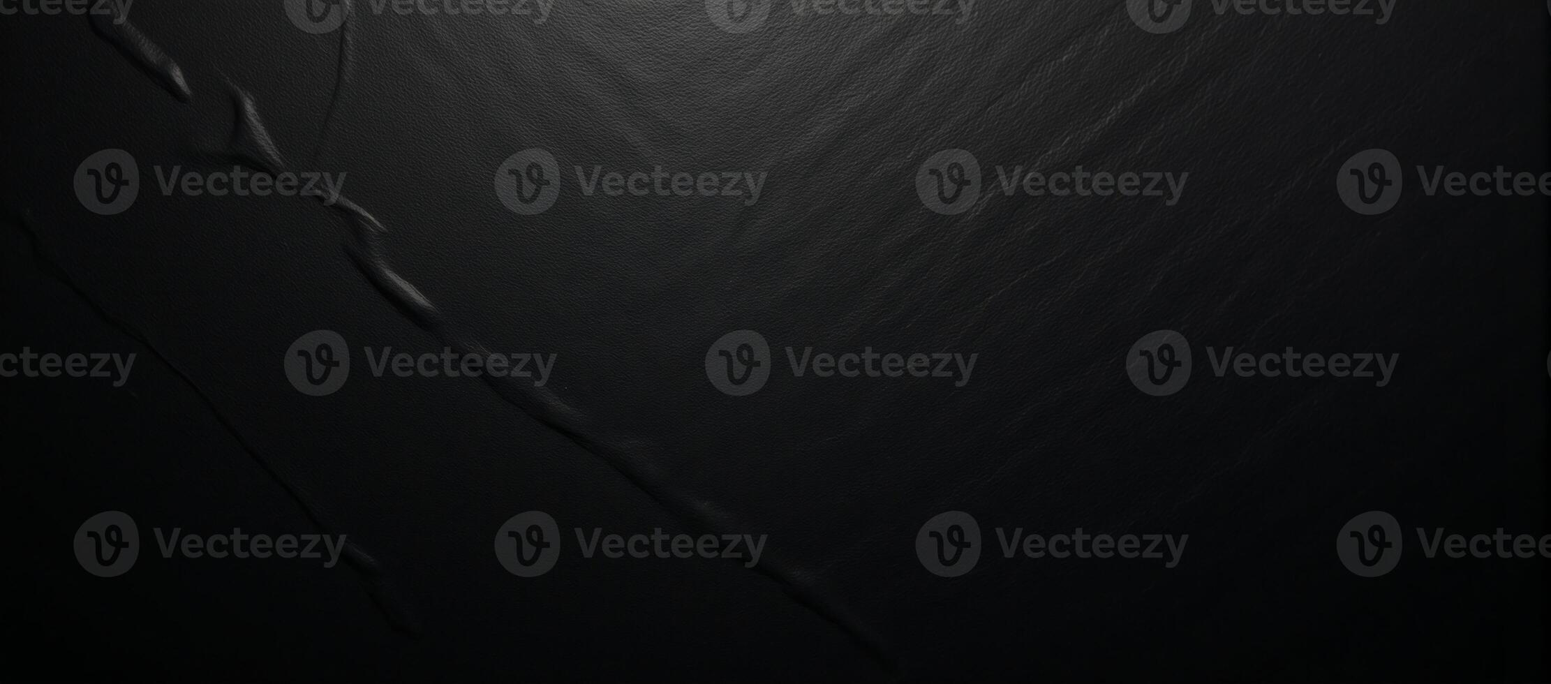 A black textured gradient background featuring an uneven matte surface photo