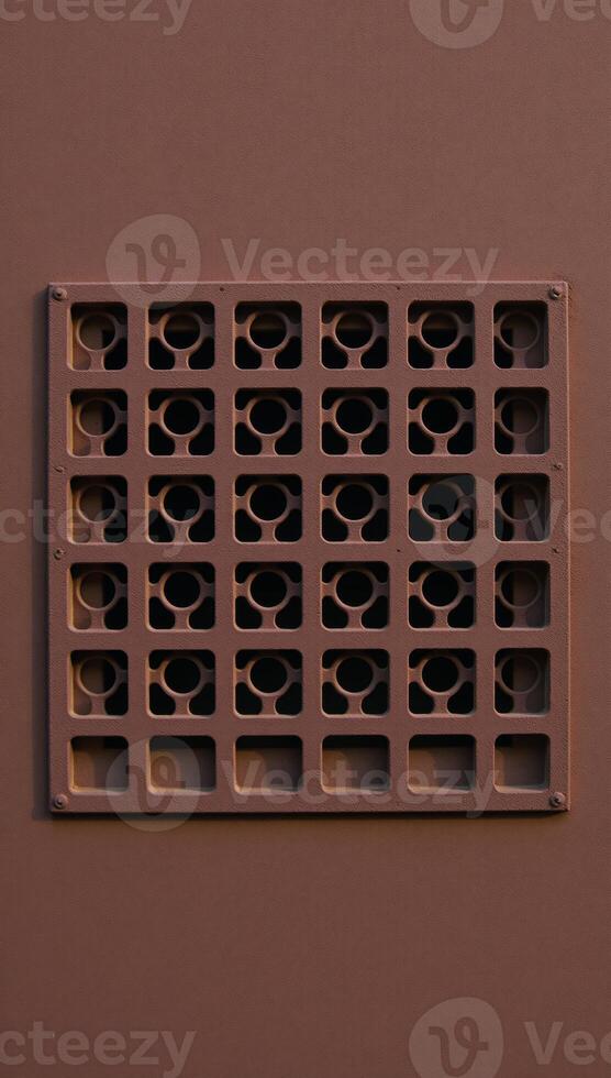 Rusty metal panel with rectangular vent circular hole pattern photo