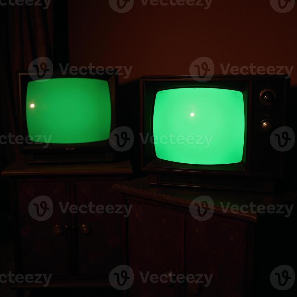 Dark room featuring vintage TV sets with emeraldhued screens photo