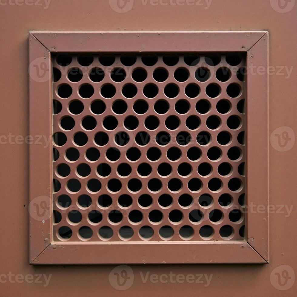 Rusty metal panel with rectangular vent circular hole pattern photo