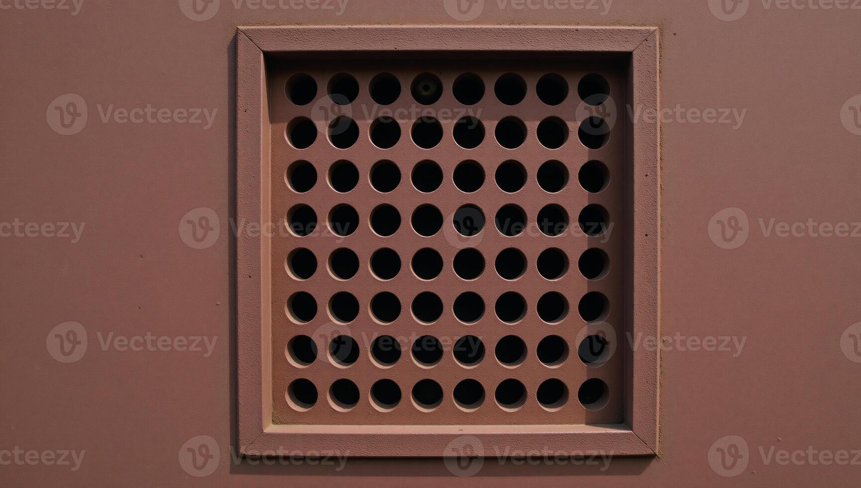 Rusty metal panel with rectangular vent circular hole pattern photo