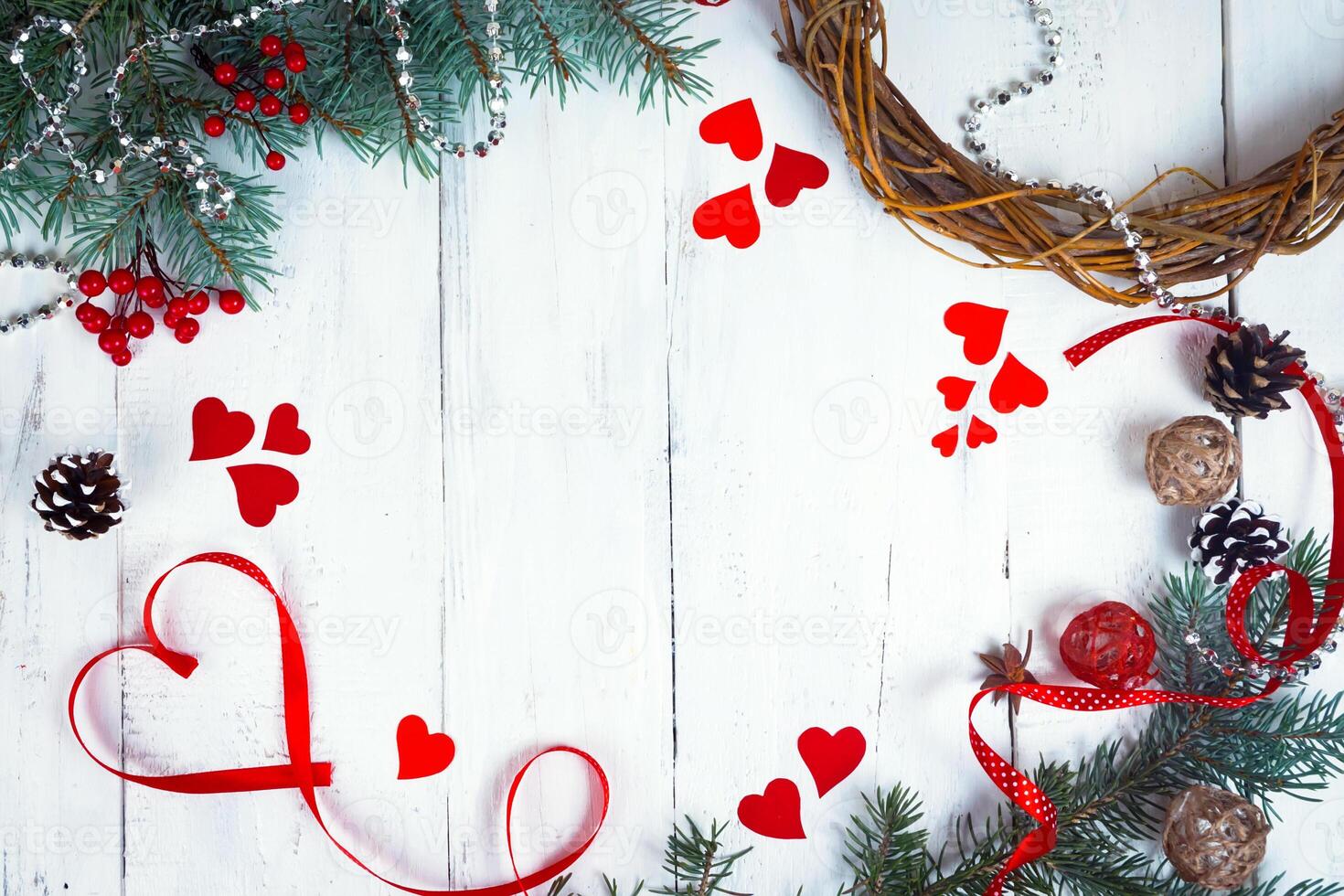 Valentine's day background, hearts and branches of a Christmas tree on a white tree. place for text. top view photo