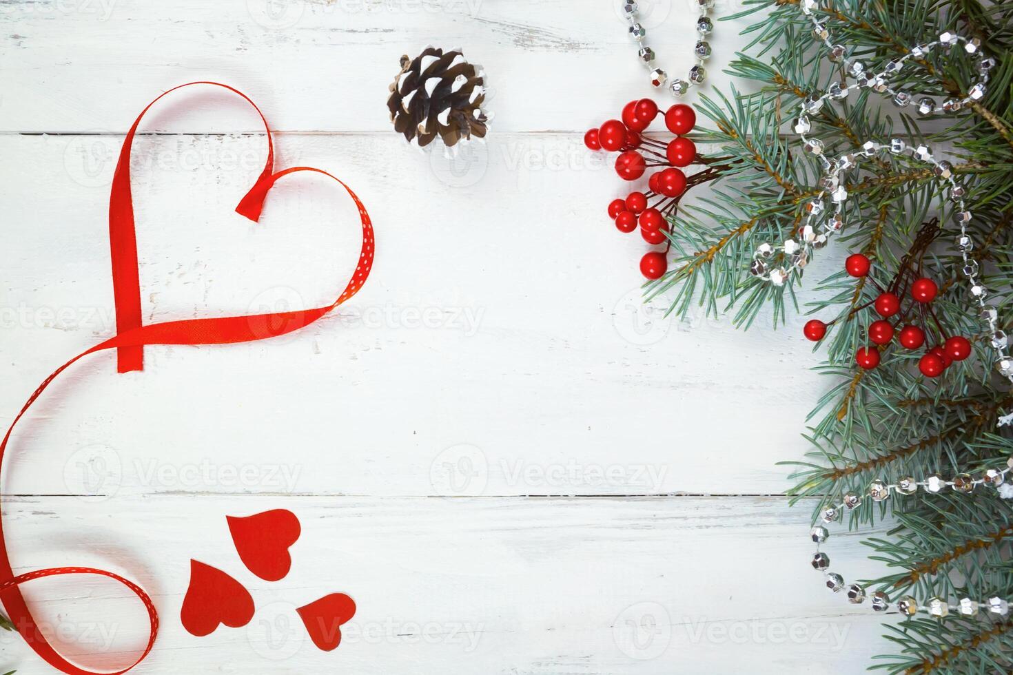 Valentine's day background, hearts and branches of a Christmas tree on a white tree. place for text. top view photo