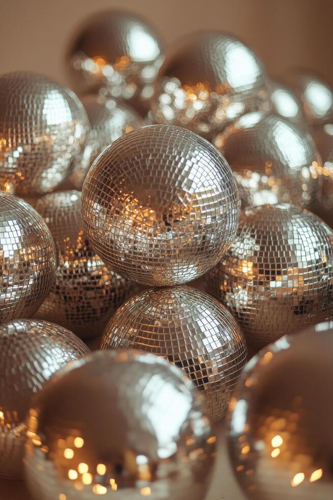 Shiny disco balls piled together in a festive setting ready for a party celebration photo