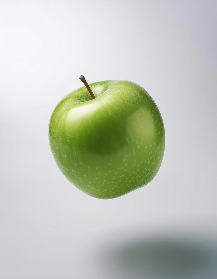Green apple floating in the air on a clean white background photo