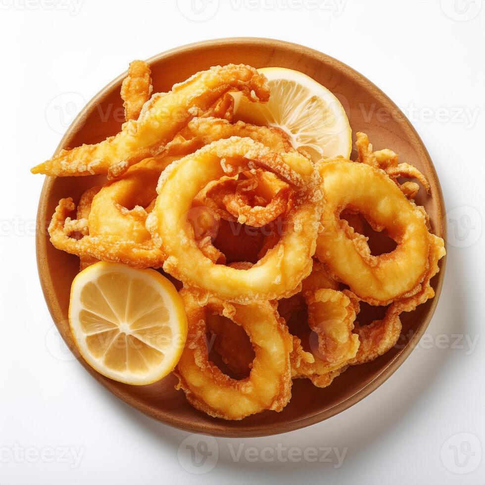 Fried squid rings with lemon slices on a plate photo