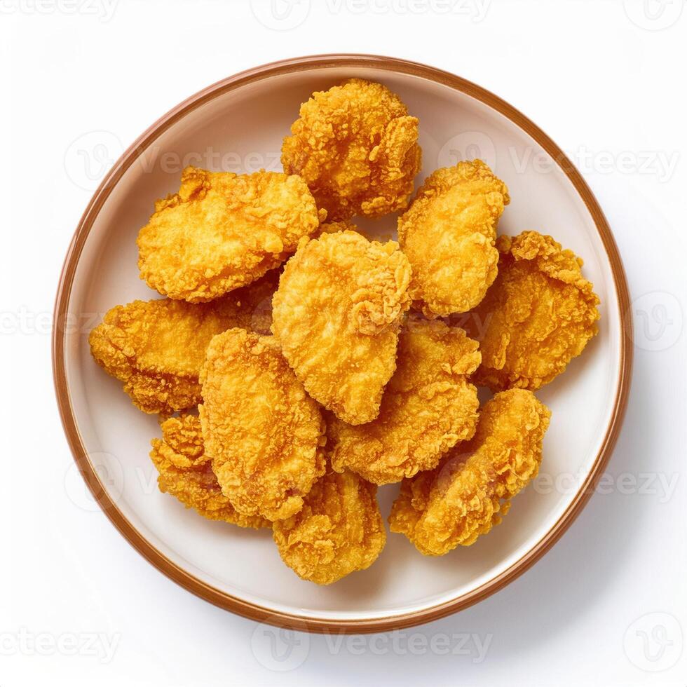 A bowl of fried chicken nuggets on a white background photo