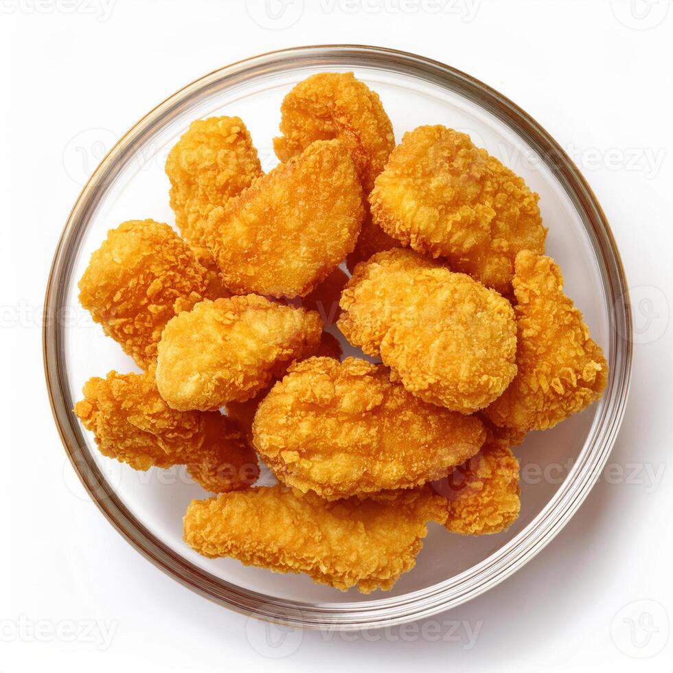 A bowl of fried chicken nuggets on a white background photo