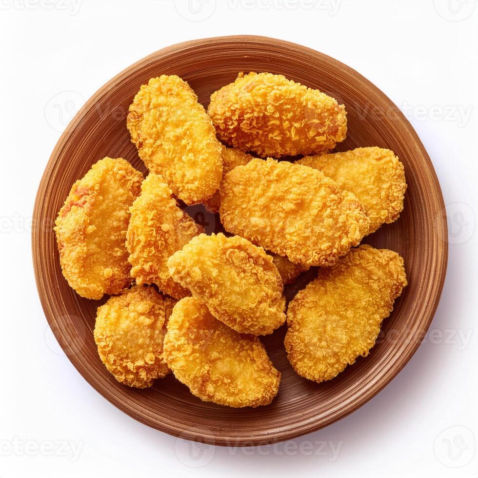 A plate of fried chicken nuggets on a white background photo