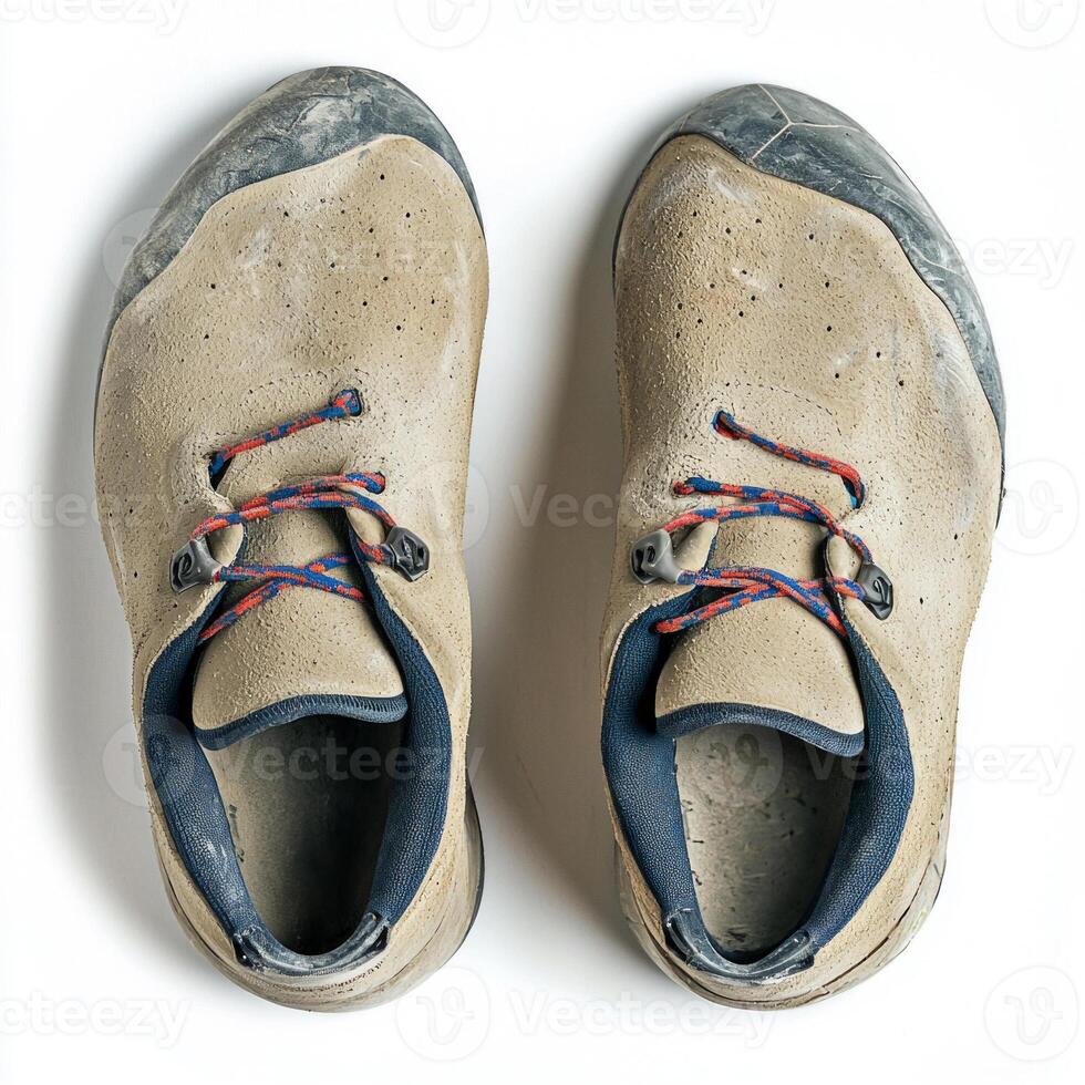 pair of climbing shoes showcases durable rubber soles and secure velcro straps captured in bright lighting to highlight their design and functionality for adventure sports. photo