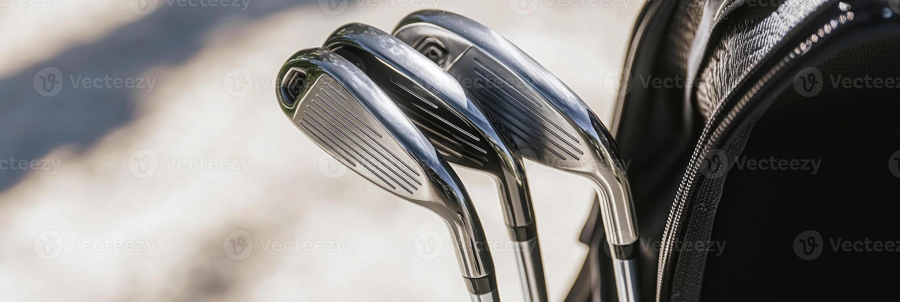 set of golf clubs stands upright in a textured golf bag showcasing polished club heads. Soft shadows enhance the midday atmosphere highlighting a realistic sports accessory setup. photo