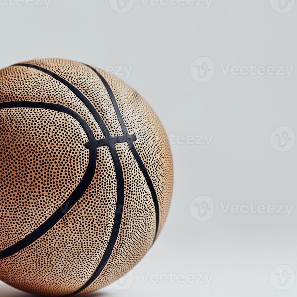 beautifully textured basketball is highlighted against a minimalist white backdrop emphasizing its distinctive black lines and subtle shadows under midday lighting. photo