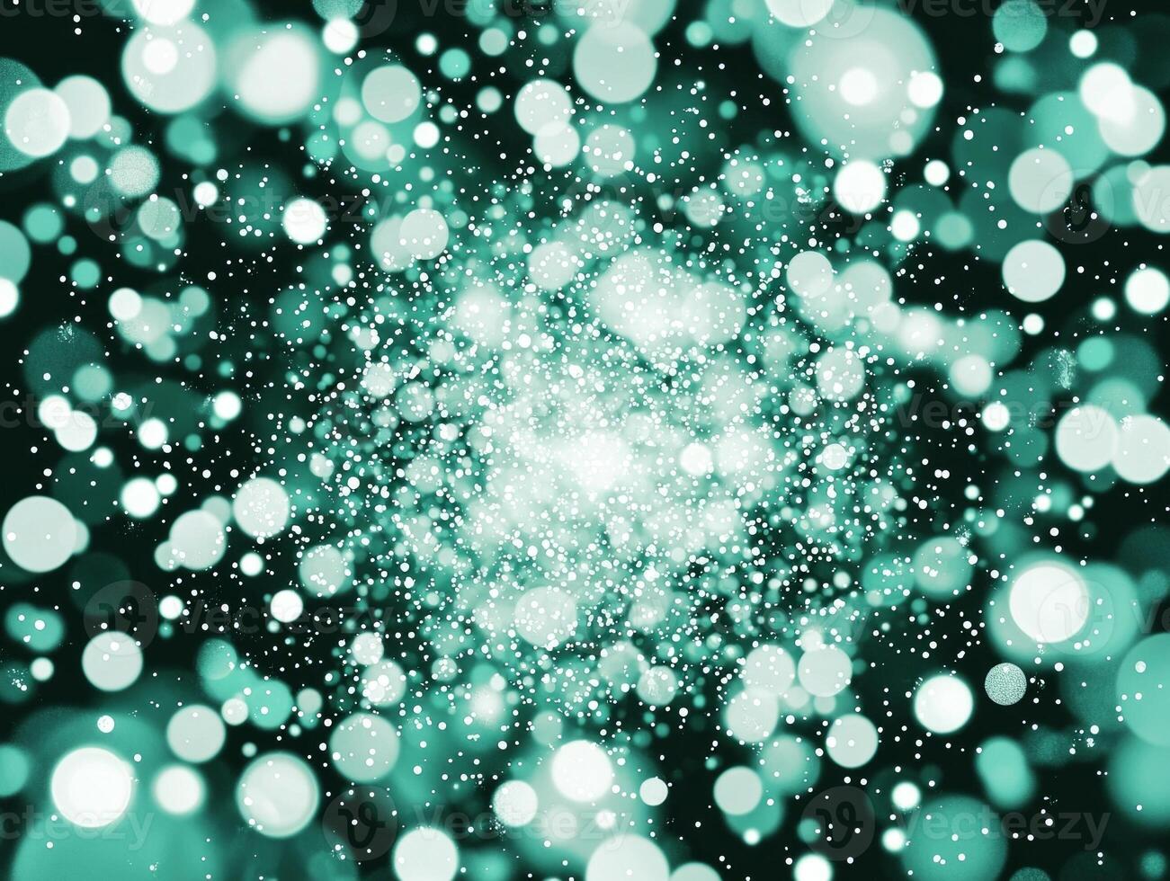 An explosion of turquoise dots and particles radiates outward from a central point, set against a stark black background, evoking a sense of dynamic energy and luminous movement. photo