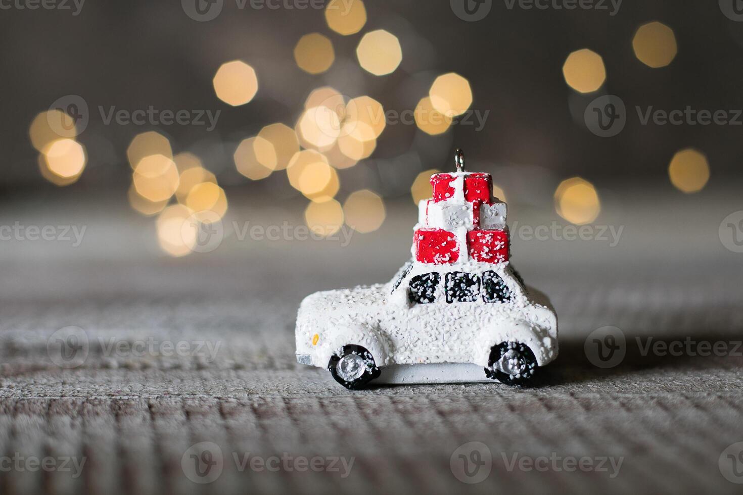 Christmas Card Holiday Concept with toy car and magic bokeh lights. Copy space. Abstract Background photo