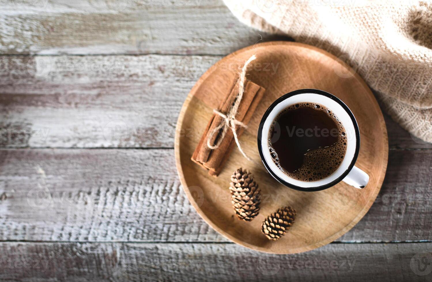 Cocoa on wooden tray on wooden table background. Holiday beverage. Top view, flat lay, copy space photo
