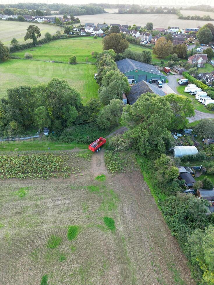 High Angle View of British Agricultural Farms at Streatley Village and Countryside Landscape of Bedfordshire, England Great Britain of UK. Footage Was Captured with Drone's Camera on October 7th, 2024 photo