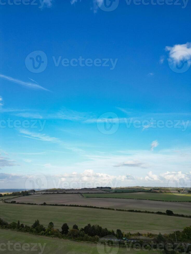 High Angle View of British Agricultural Farms at Streatley Village and Countryside Landscape of Bedfordshire, England Great Britain of UK. Footage Was Captured with Drone's Camera on October 7th, 2024 photo