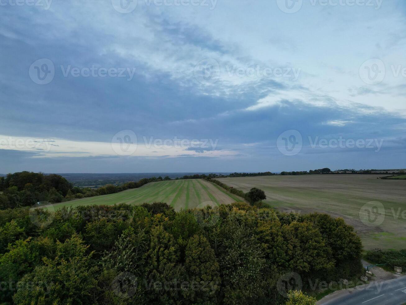 High Angle View of British Agricultural Farms at Streatley Village and Countryside Landscape of Bedfordshire, England Great Britain of UK. Footage Was Captured with Drone's Camera on October 7th, 2024 photo