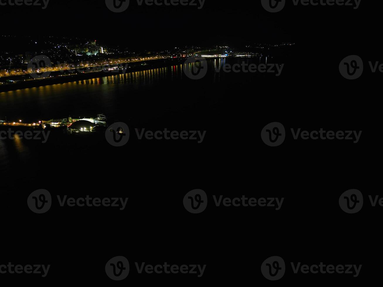 Aerial View of Illuminated Brighton and Hove City of England United Kingdom During Dark Night of May 9th, 2024 photo
