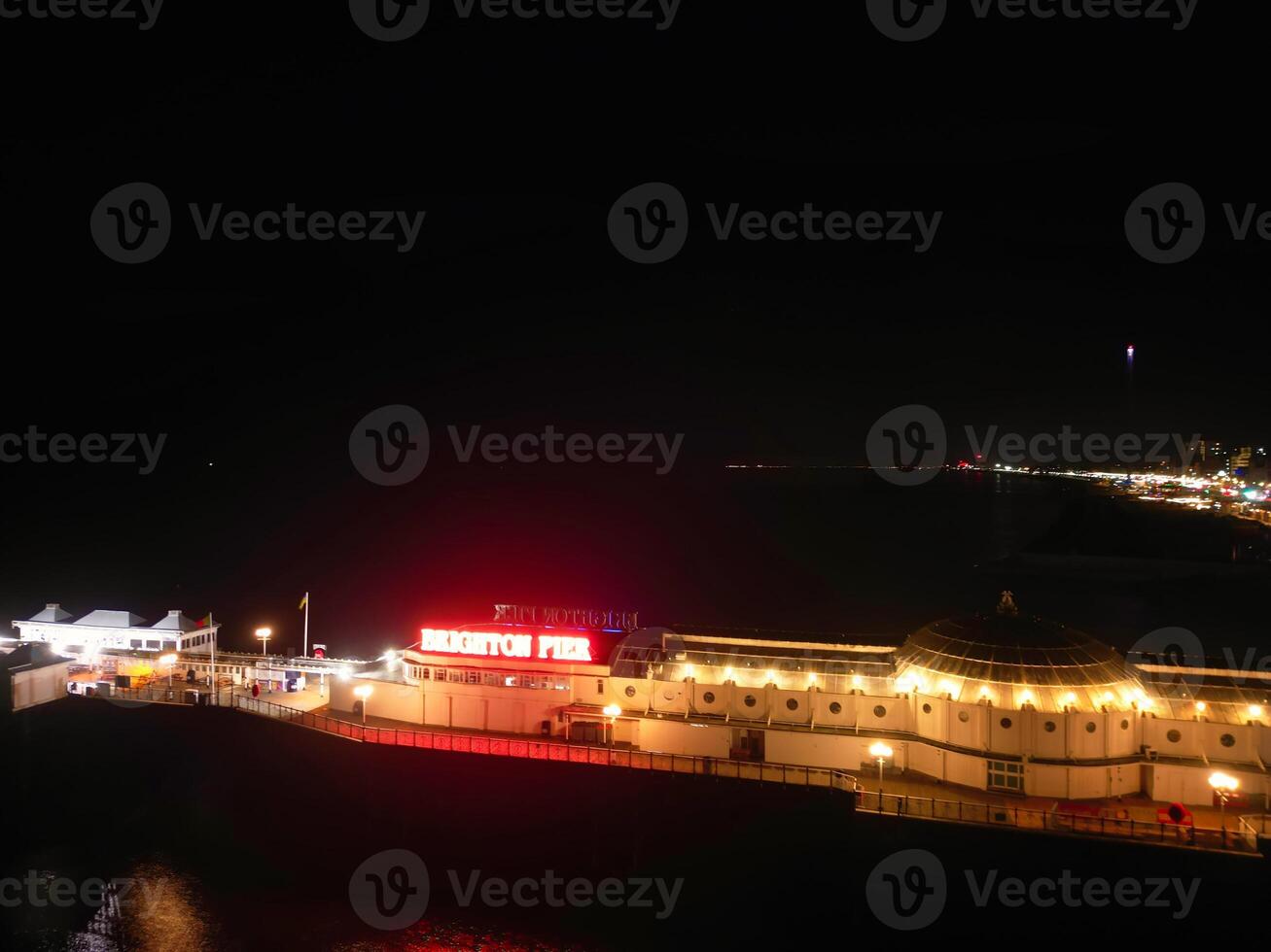 Aerial View of Illuminated Brighton and Hove City of England United Kingdom During Dark Night of May 9th, 2024 photo