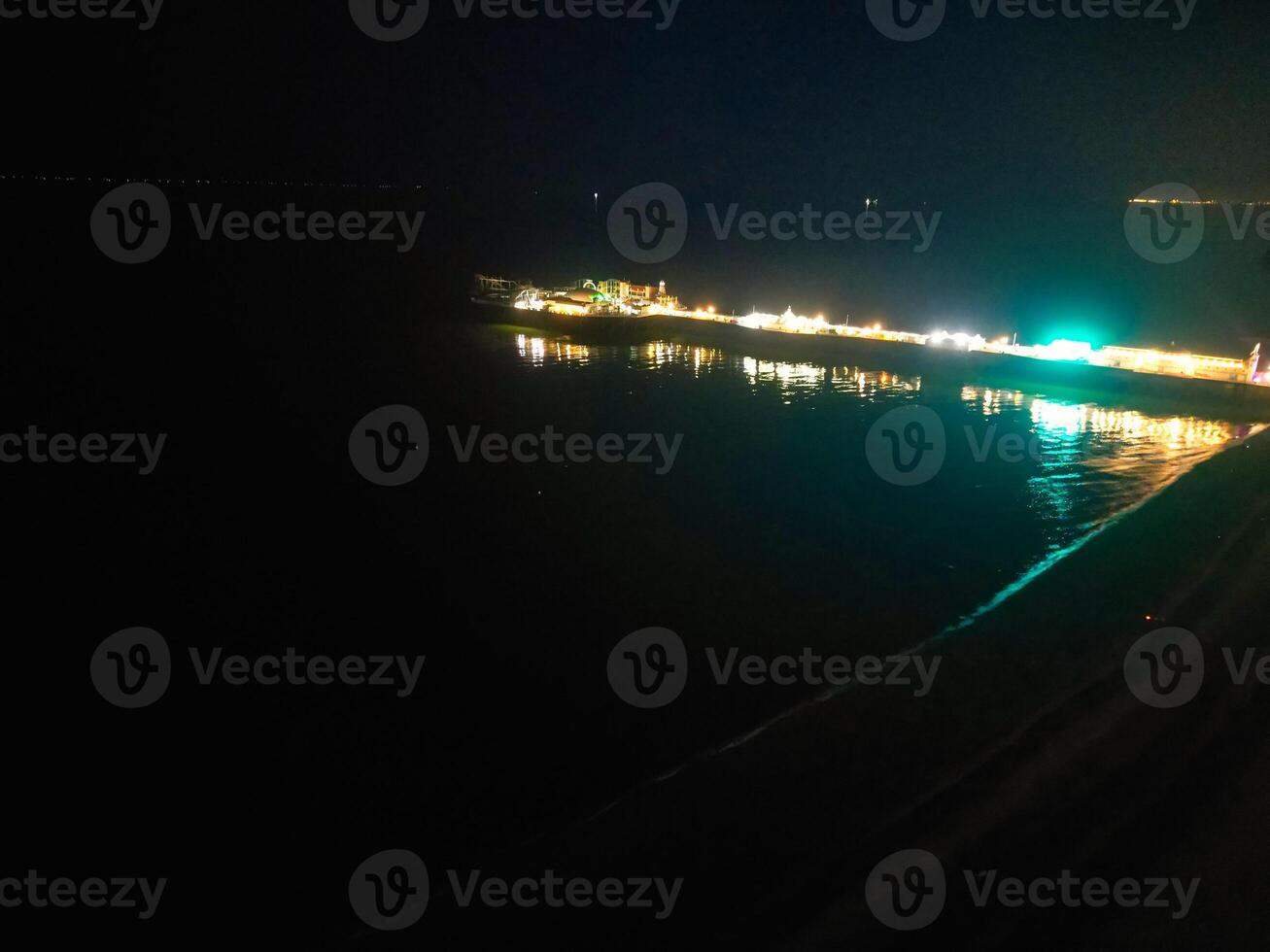 Aerial View of Illuminated Brighton and Hove City of England United Kingdom During Dark Night of May 9th, 2024 photo