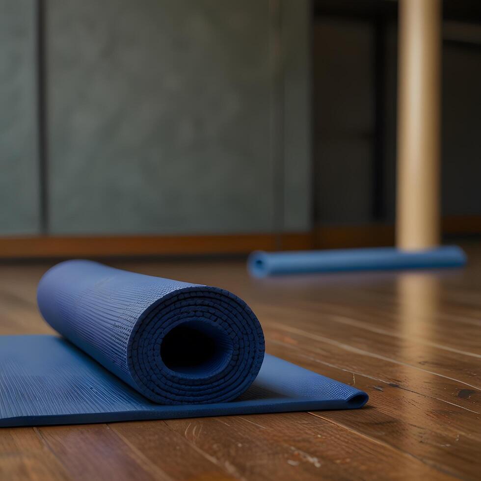 Blue pilates fitness yoga mat for exercise in the gym photo