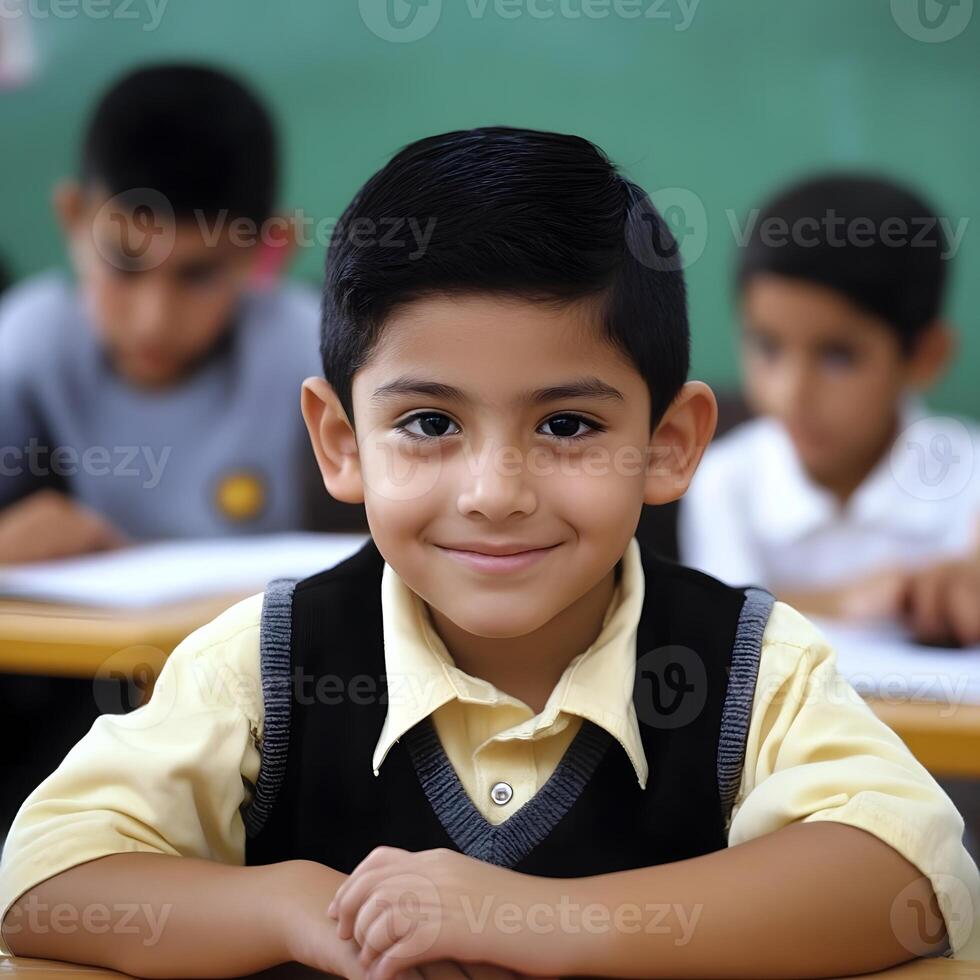 Lucky Hispanic Schoolboy learning and studying in the Classroom photo