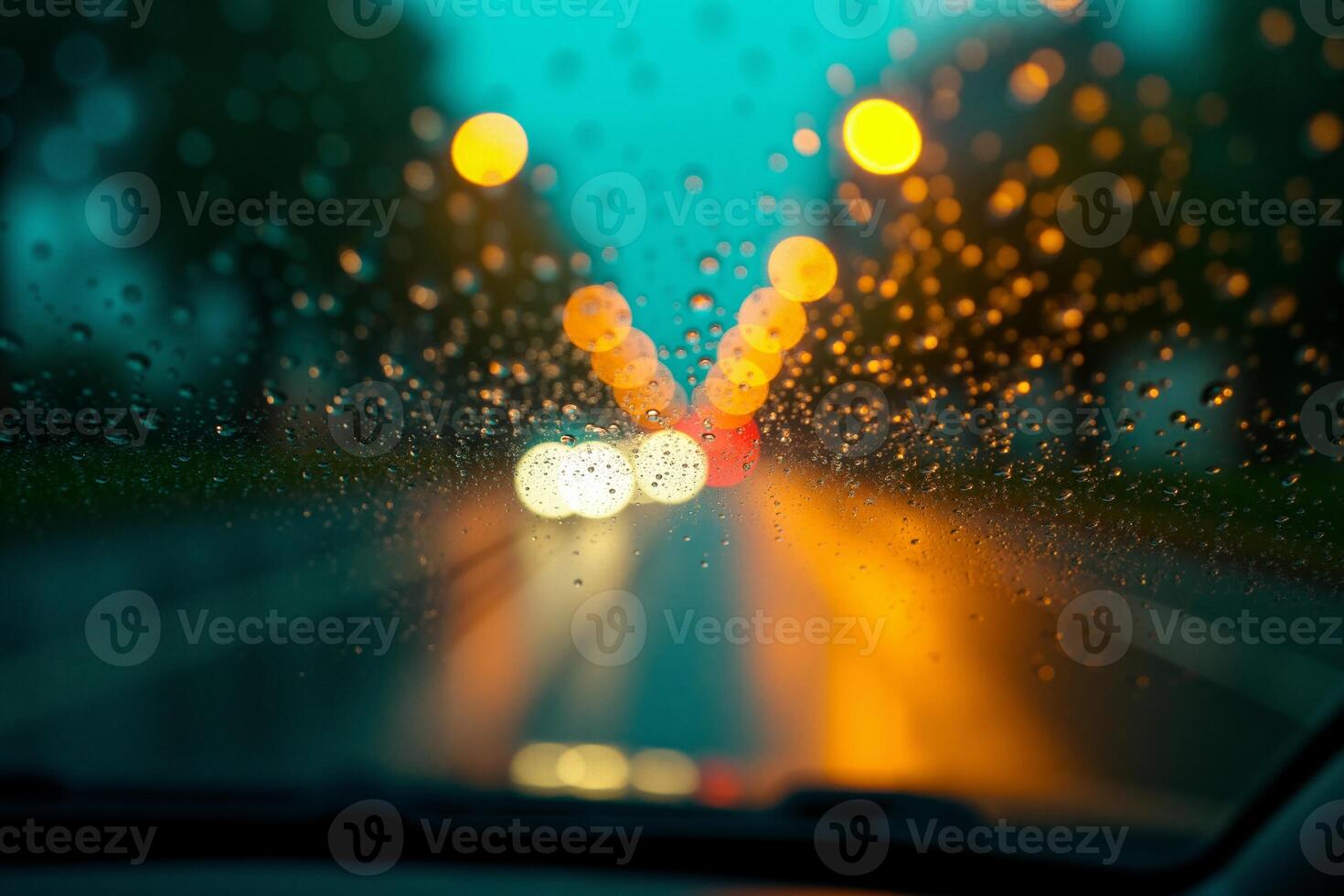 windscreen of car with rain drop water at night photo