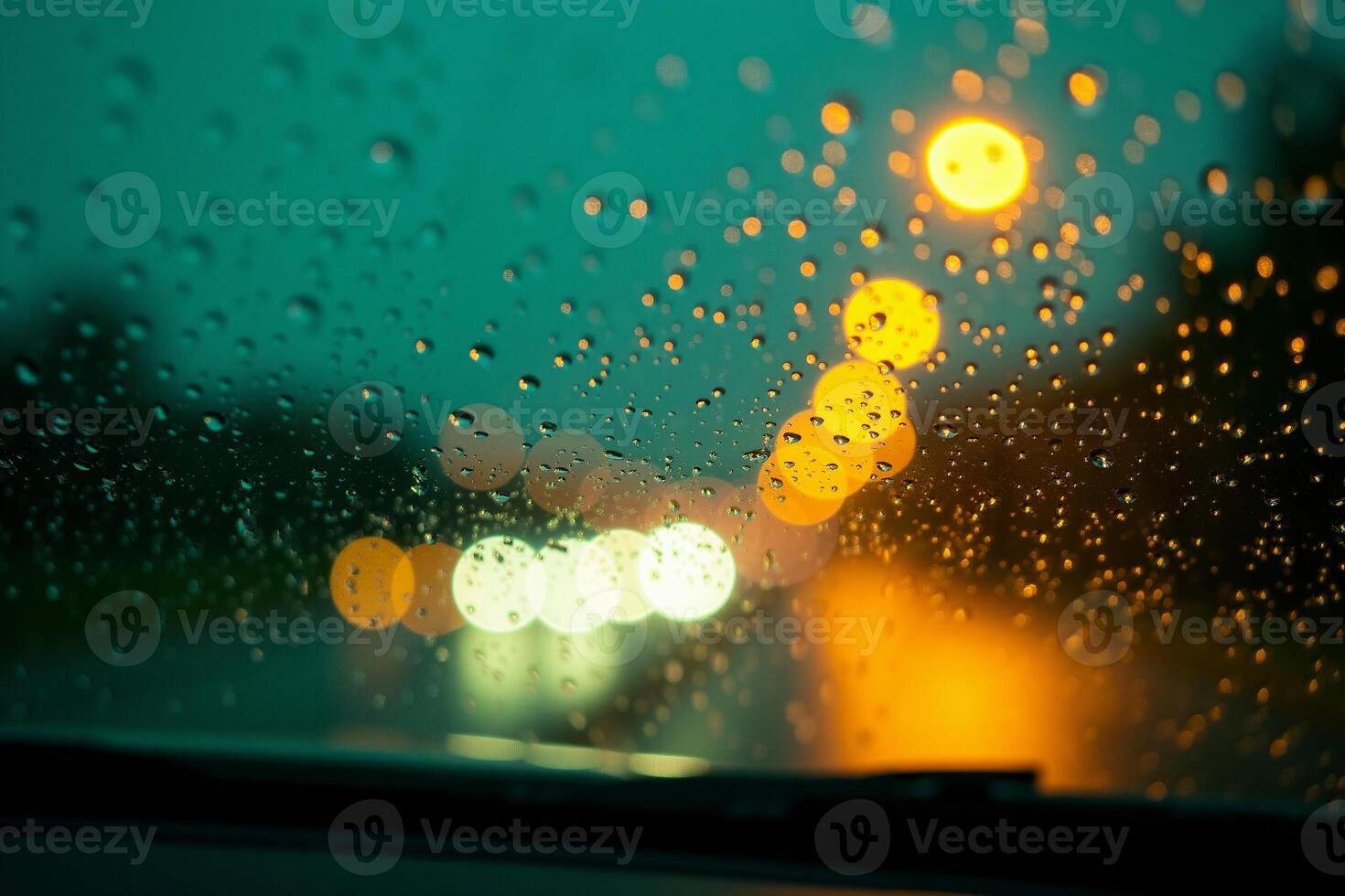 windscreen of car with rain drop water at night photo