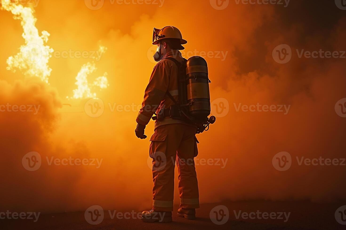 fireman with protective outfit and hose working at fire event photo