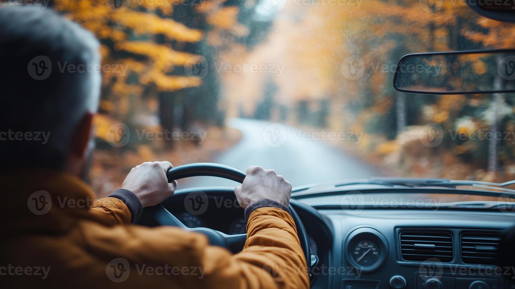 driver in a car on a country road photo