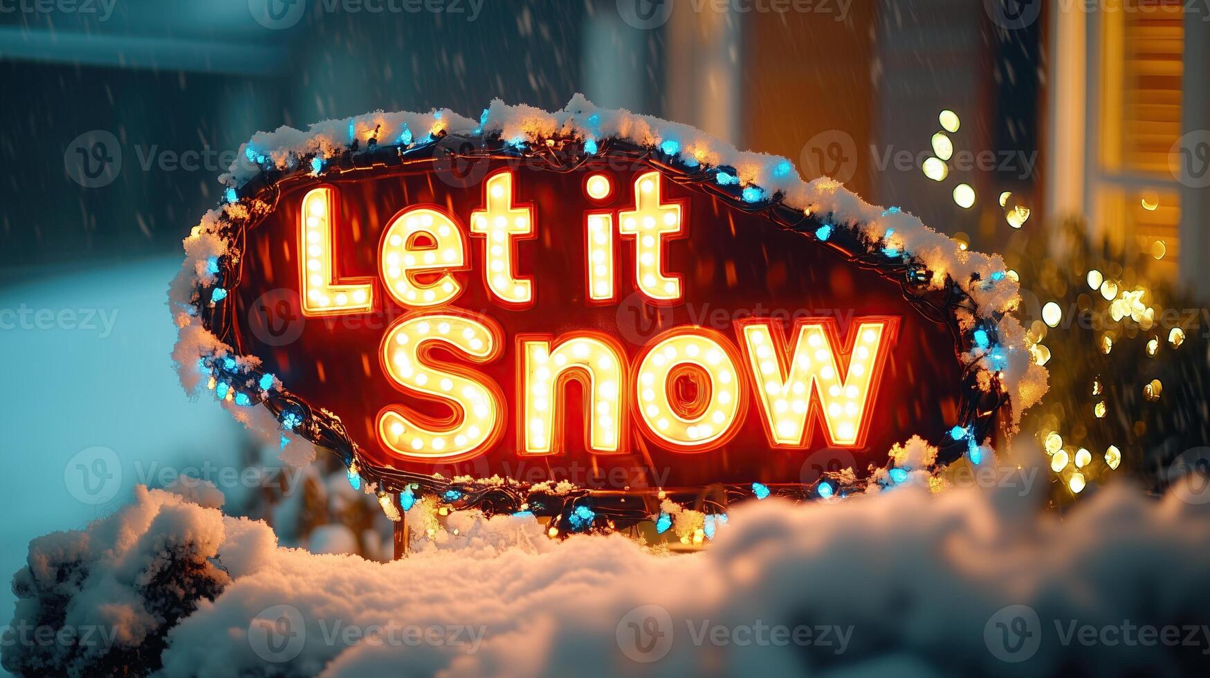 A glowing Let it Snow sign surrounded by snow and festive lights photo