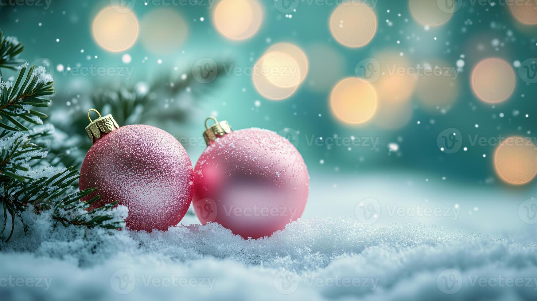 Pink baubles resting in snow with a snow-covered branch and bokeh lights photo