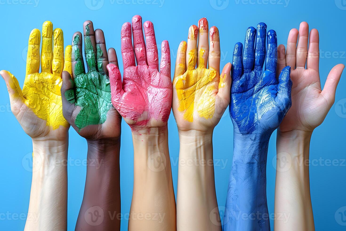Colorful Diversity Concept with Painted Hands on Blue Background photo