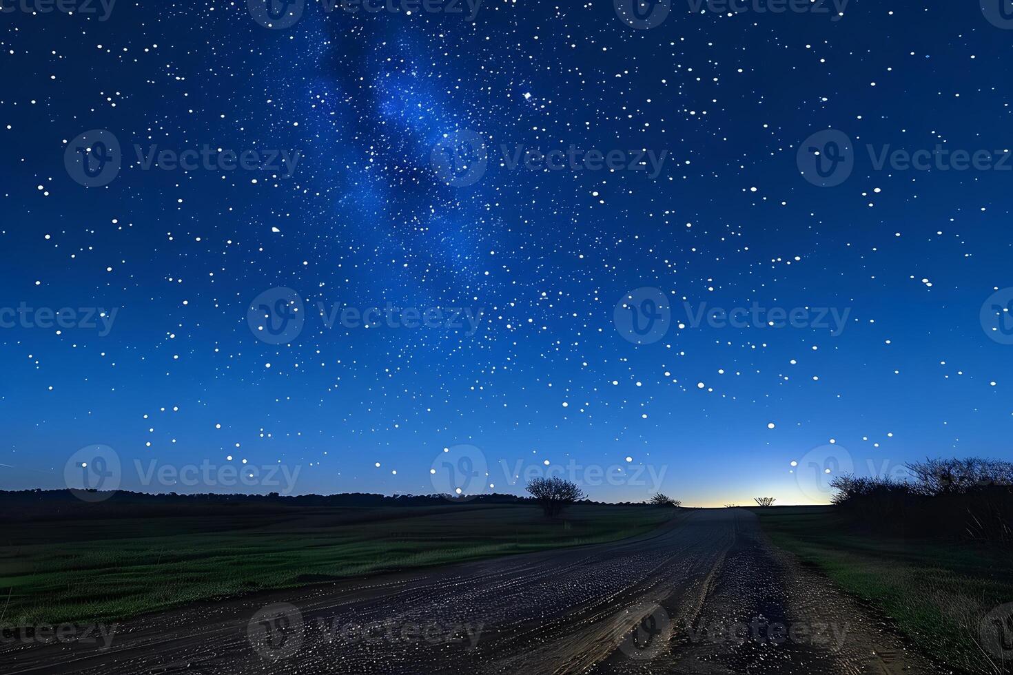Tranquil Night Sky with Starry Milky Way over Rural Dirt Road Horizon photo