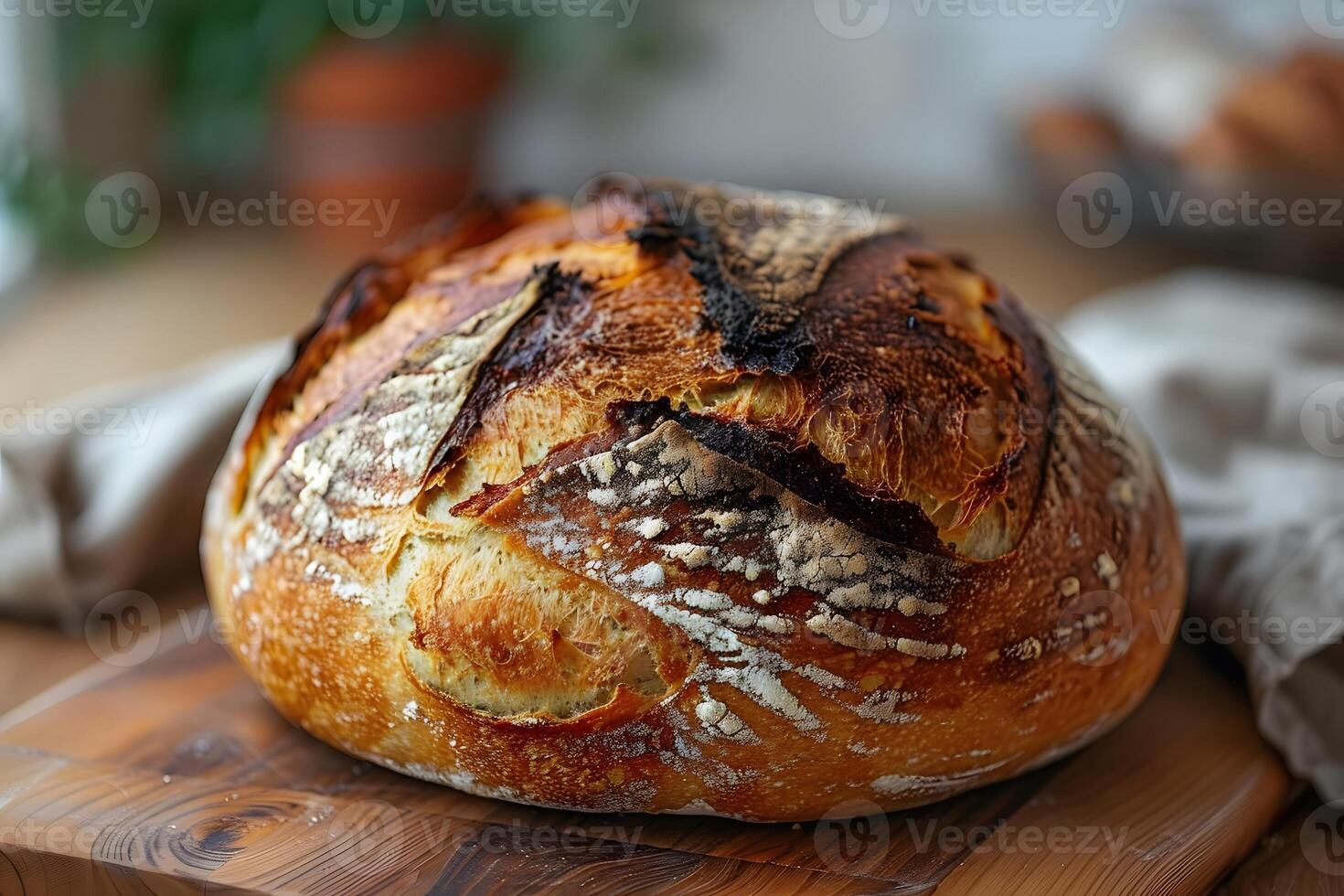 Artisan Sourdough Bread on Rustic Wooden Board for Bakery Design photo