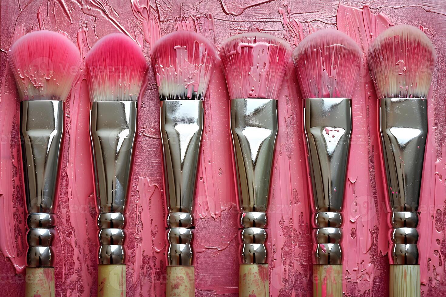 Vibrant Pink Paintbrushes on Textured Canvas for Creative Expression photo