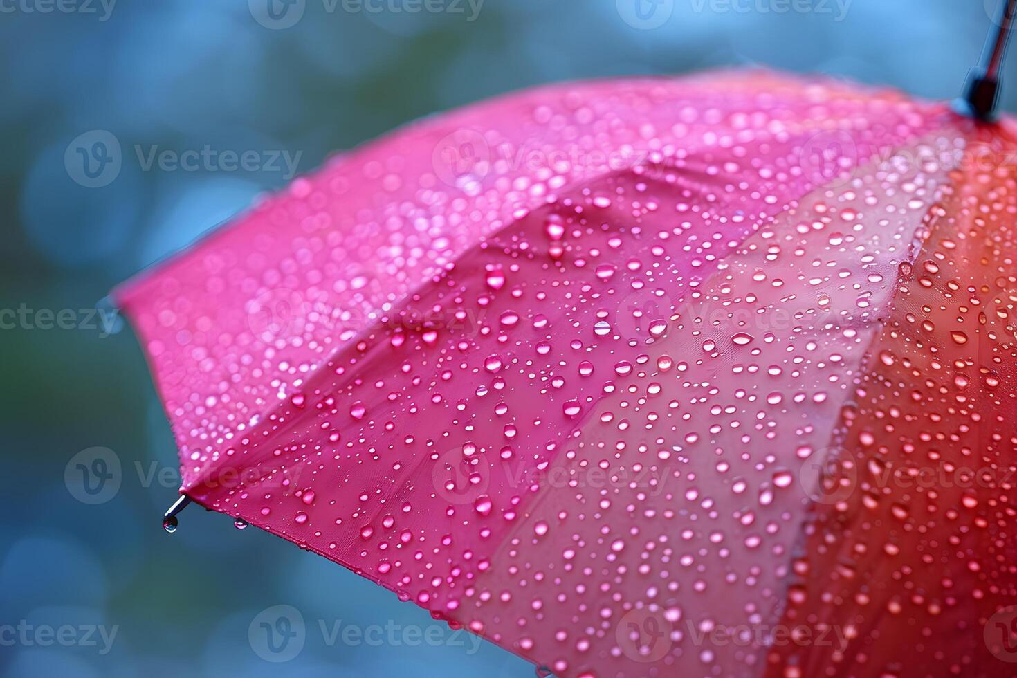 Vibrant Red Umbrella with Raindrops - Symbol of Rainy Weather and Protection photo