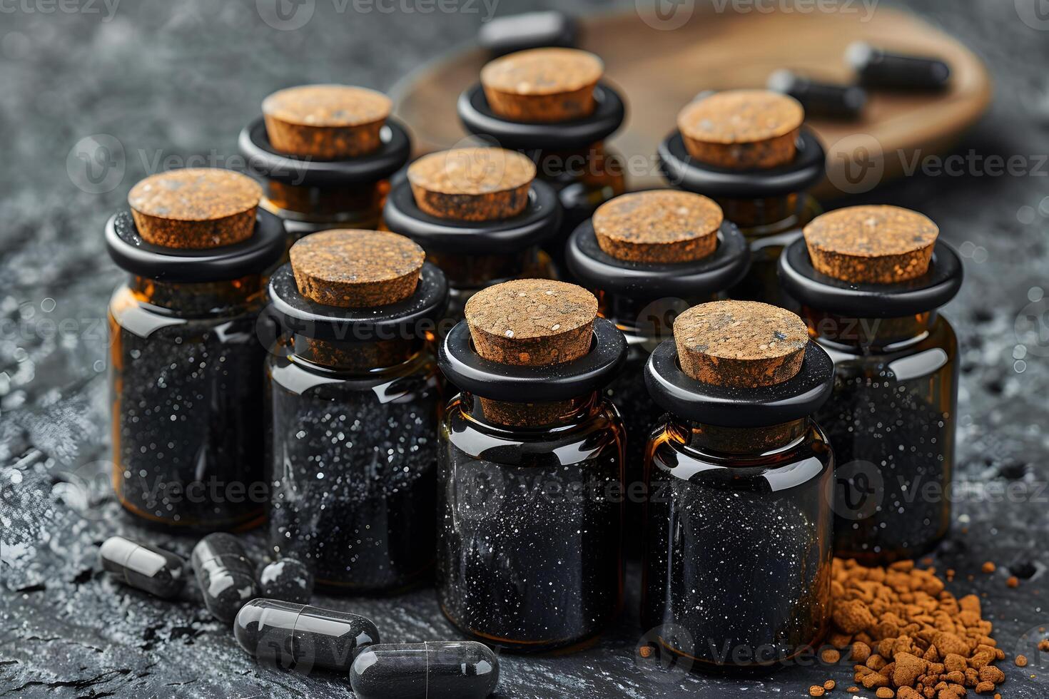 Charcoal Supplement Bottles and Capsules on Dark Background for Health and Wellness Concepts photo