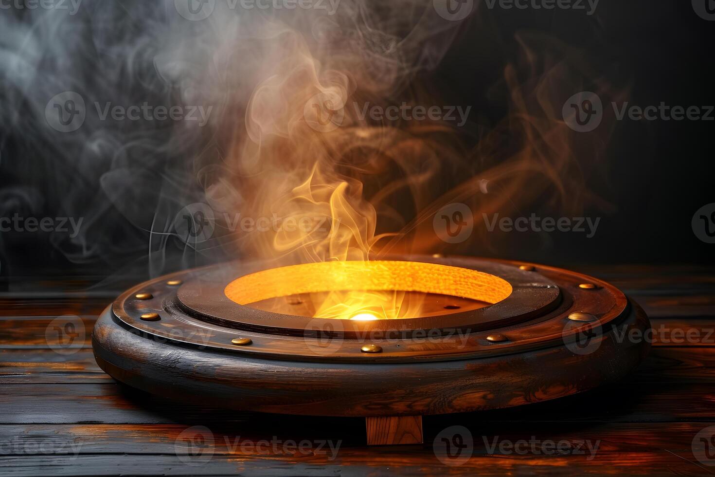 Mysterious Glowing Cauldron with Steaming Mist on Rustic Wooden Surface photo