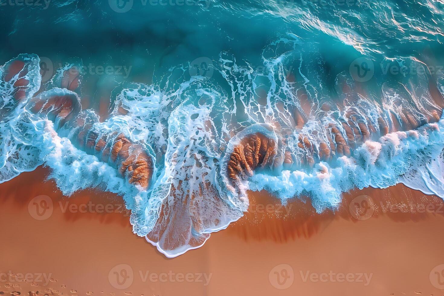An aerial view of waves crashing into the ocean photo