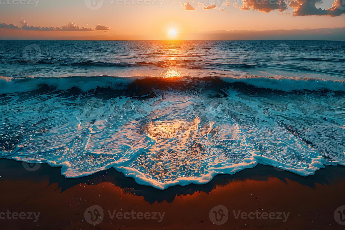 A beautiful sunset over the ocean with waves photo