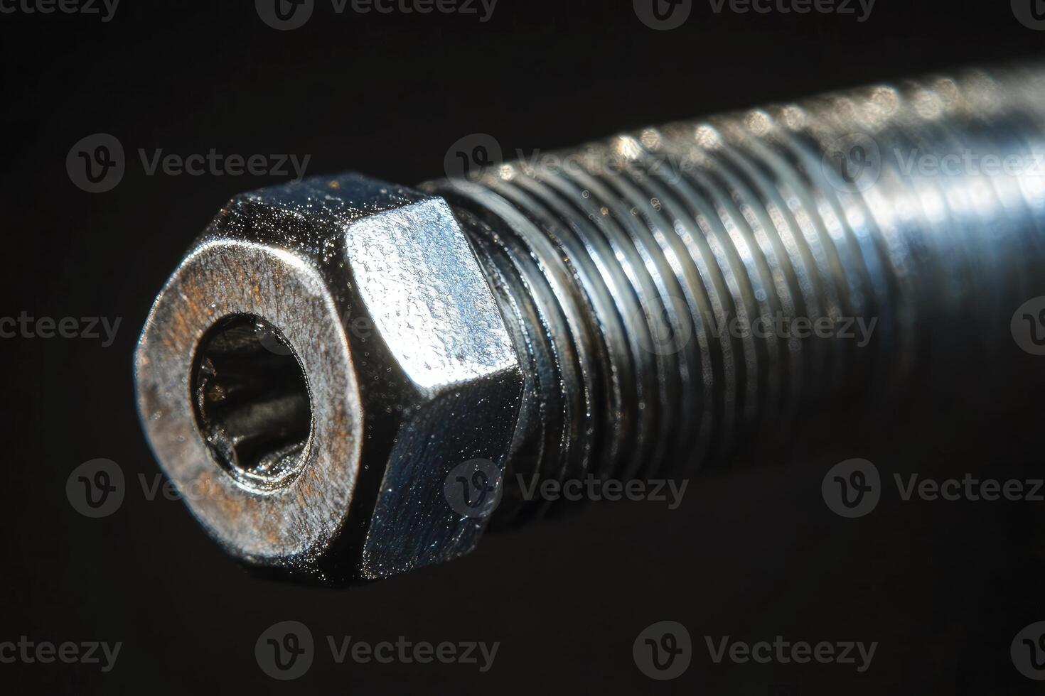 A close up of a metal screw photo
