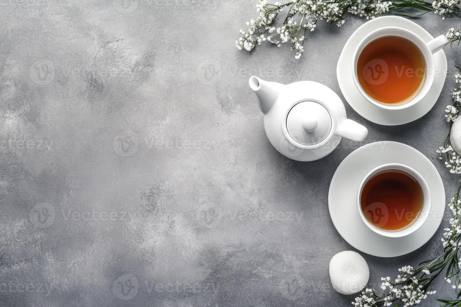 Tea and flowers on a gray background photo