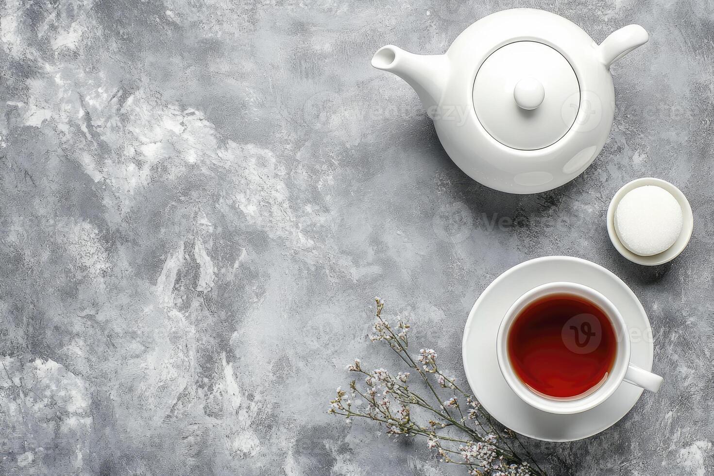 Tea and cup on grey background photo